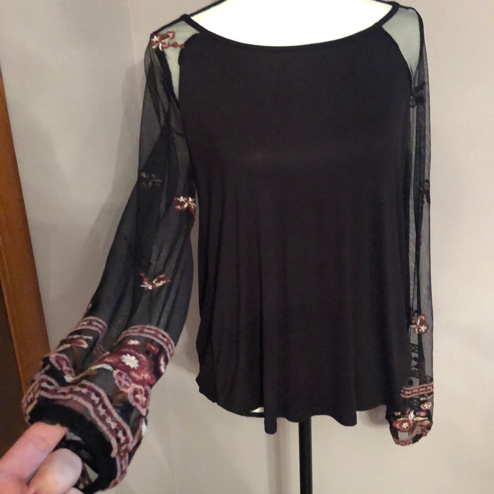 Women’s top with sheer sleeves